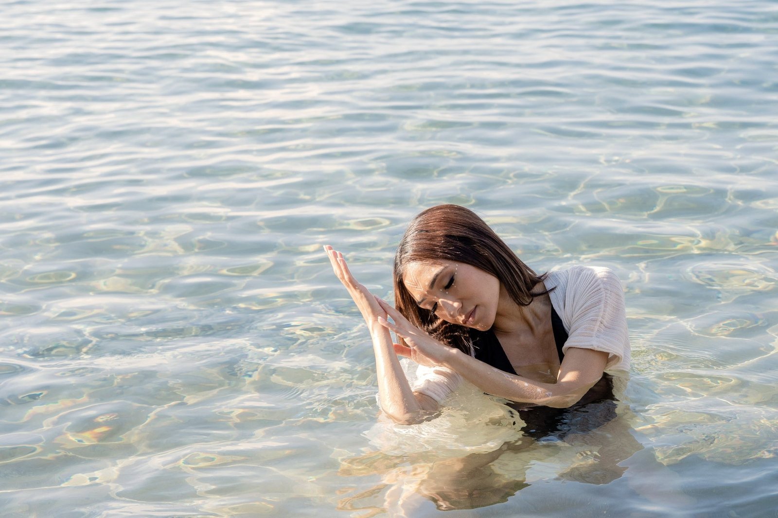 Body Recalibration: Mona Hassan in water, ritual gesture